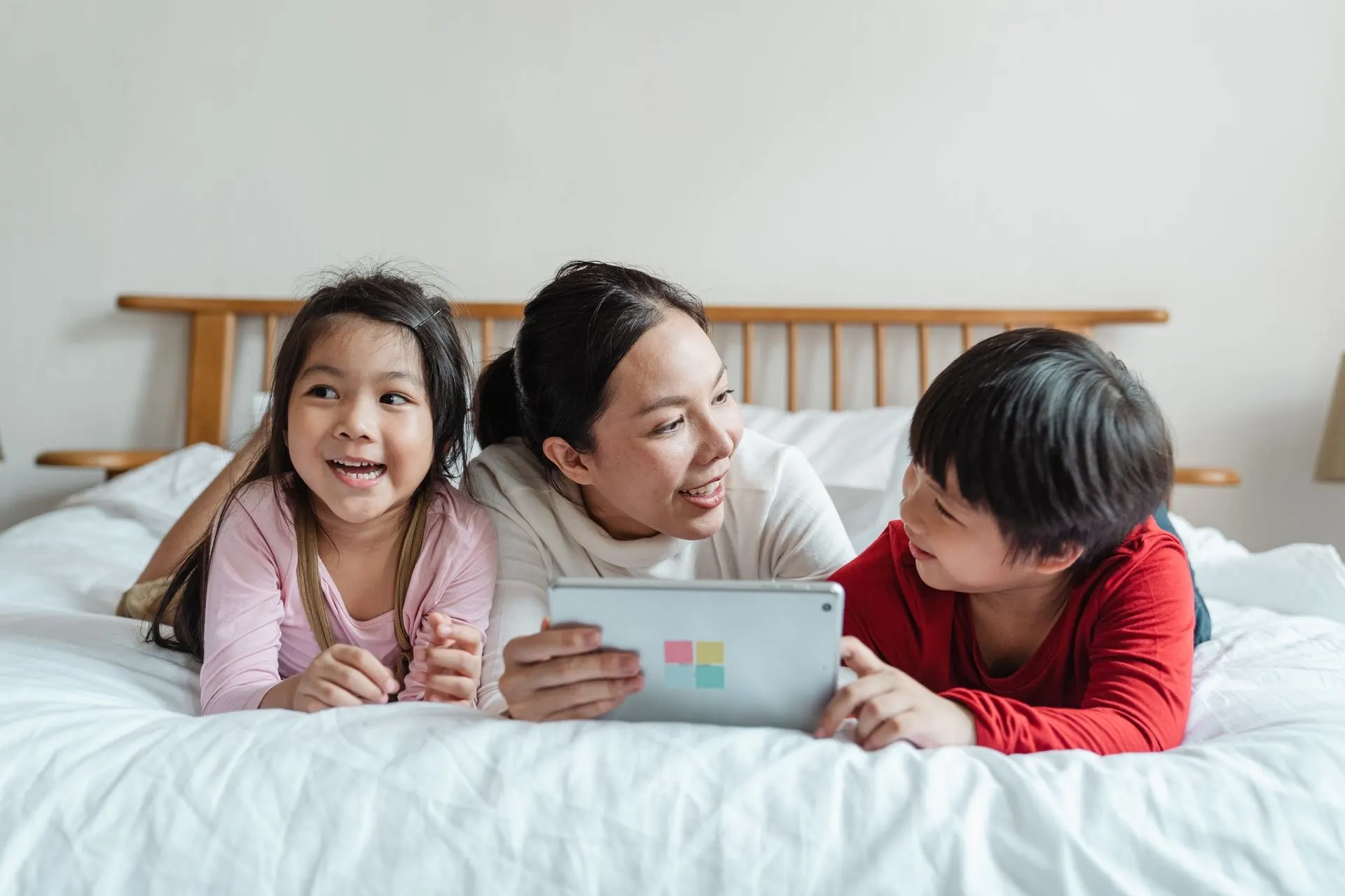 A parent and child reviewing a MagiBox learning record on a tablet