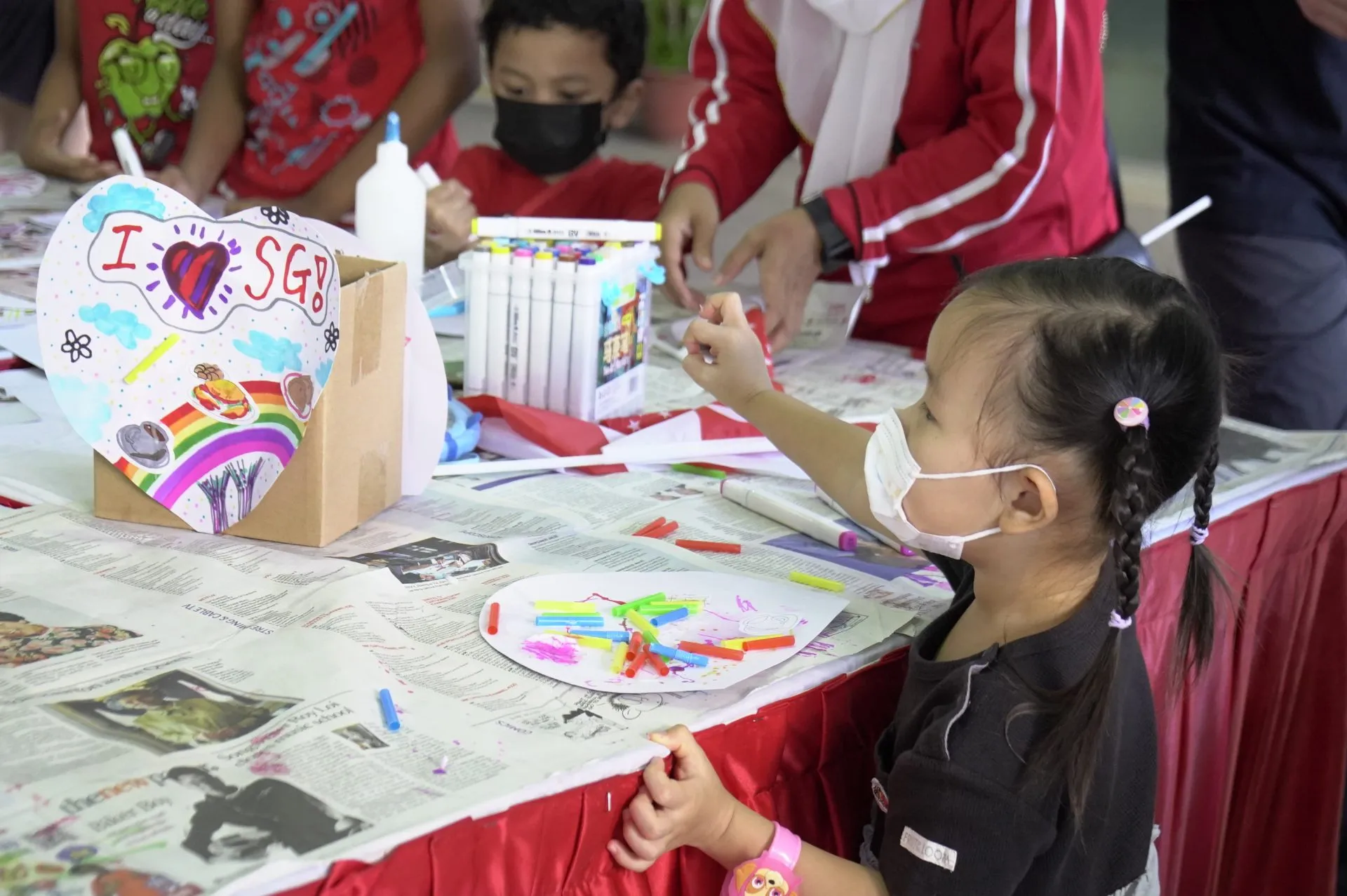 Families creating together at an OpenKids art workshop